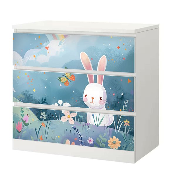 Möbelfolie IKEA Malm Hase – niedliches Design auf Blumenwiese mit Regenbogen - Sunnywall - Individualität trifft Design